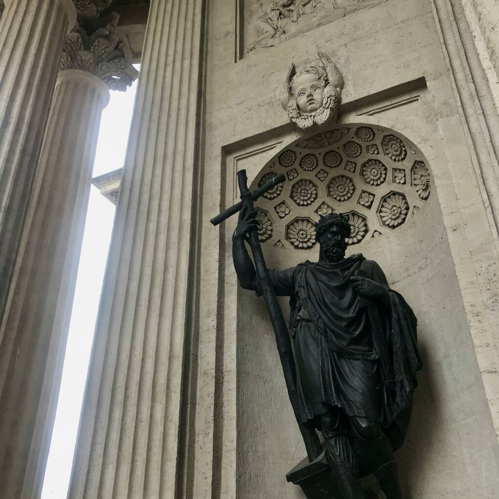 a statue of a person holding a sword